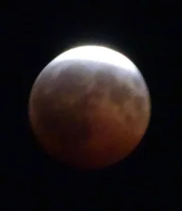 Lunar eclipse darkens moon over Minn.